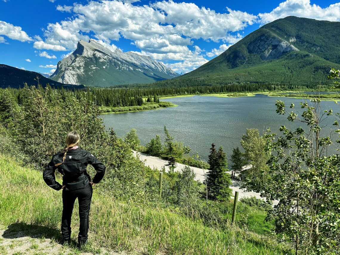 I'm standing with my hands at my hips ('superwoman pose') admiring the Vermilion Lakes Viewpoint; Banff, Alberta (Canada)