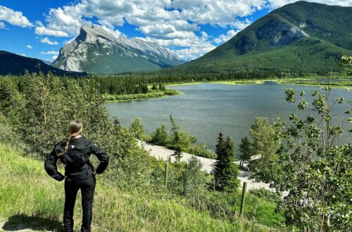 I'm standing with my hands at my hips ('superwoman pose') admiring the Vermilion Lakes Viewpoint; Banff, Alberta (Canada)