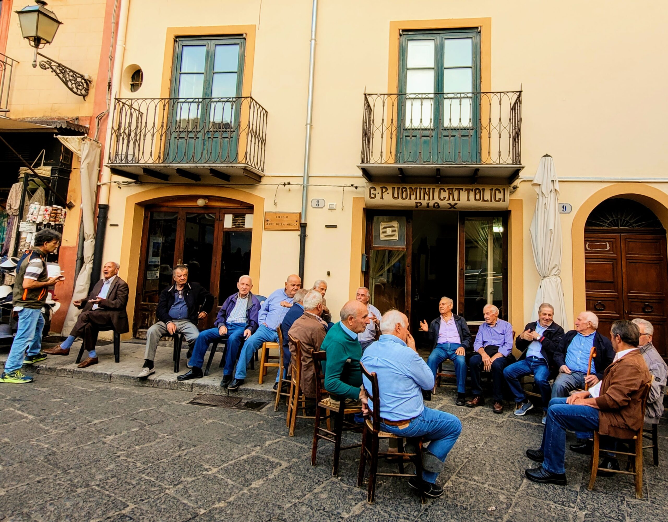 The daily ritual of the local men in the town square (and Paul's future hang out)