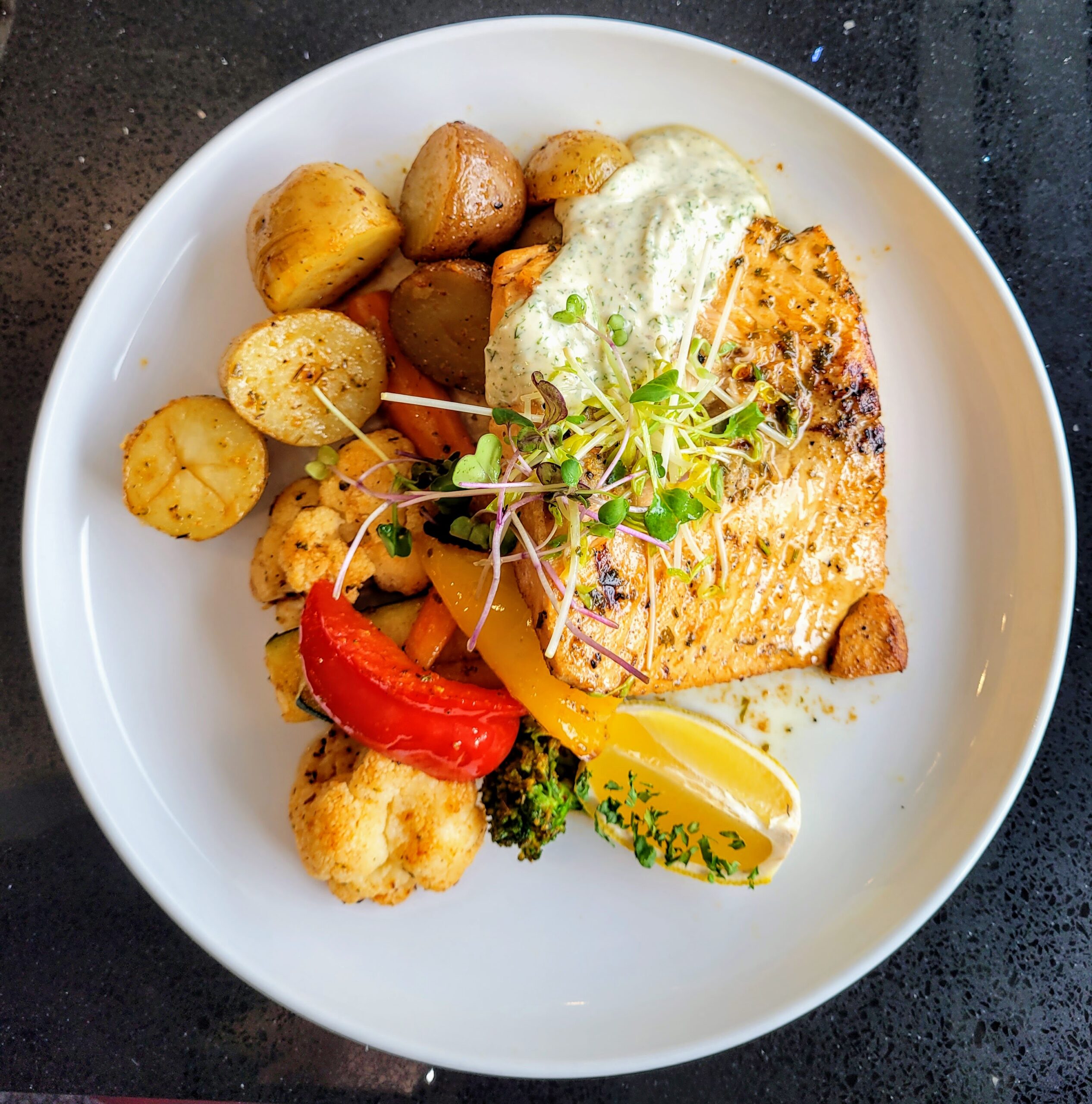 Salmon and roasted vegetables at Executive Residency by Best Western hotel restaurant; Calgary, Alberta (Canada)