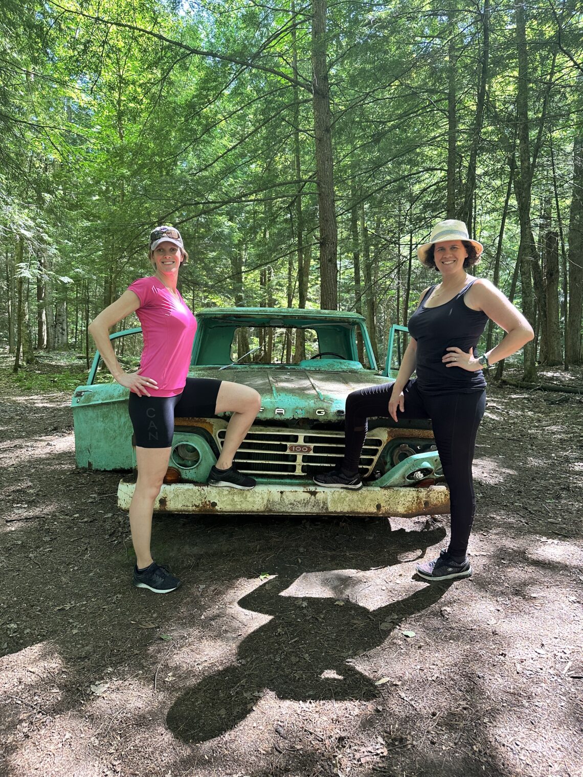 My sister and I posing in front of an abandoned green car during our hike at Grant's Woods Nature Reserve; Orillia, Ontario (Canada)