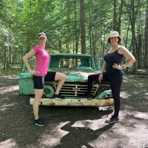 My sister and I posing in front of an abandoned green car during our hike at Grant's Woods Nature Reserve; Orillia, Ontario (Canada)