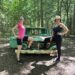 My sister and I posing in front of an abandoned green car during our hike at Grant's Woods Nature Reserve; Orillia, Ontario (Canada)