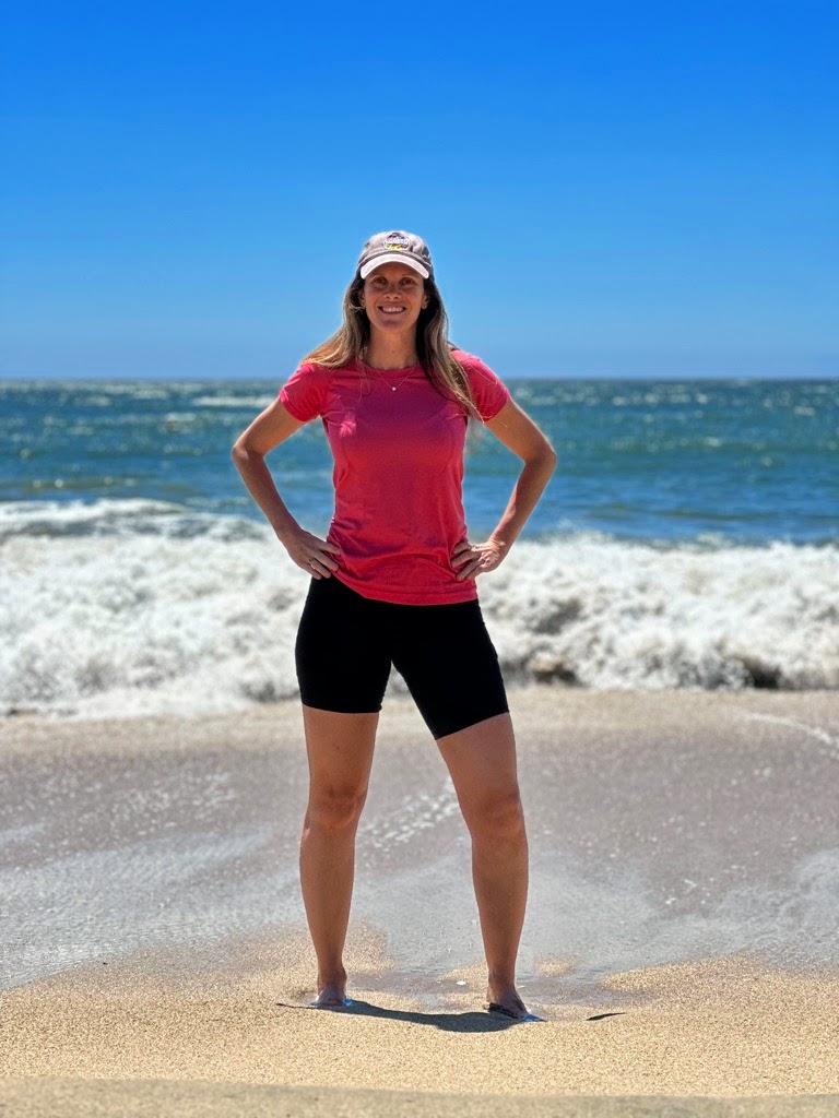 I'm standing with my hands on my hips on the sandy Playa Casino Beach; Viña del Mar, Chile