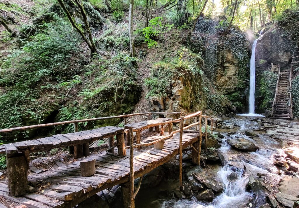 Rustic seating area in front of the 7th waterfall @ Kamenjane Waterfall Trail, North Macedonia