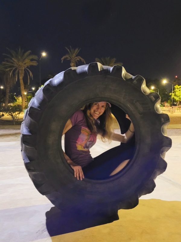 Playing in a random tractor tire on New Year's Eve; La Paz, Baja California Sur (Mexico)