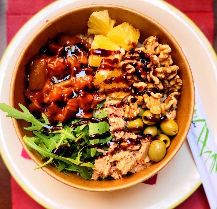 A smoked salmon poke bowl with rice, nuts, olives, salad greens, pineapple and barbeque sauce @ Do' House; Castelbuono, Sicily (Italy)