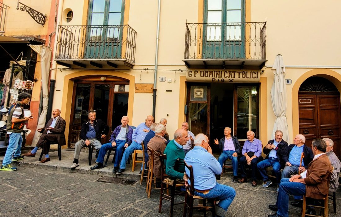 The daily ritual of the local men in the town square (and Paul's future hang out); Castelbuono, Sicily (Italy)