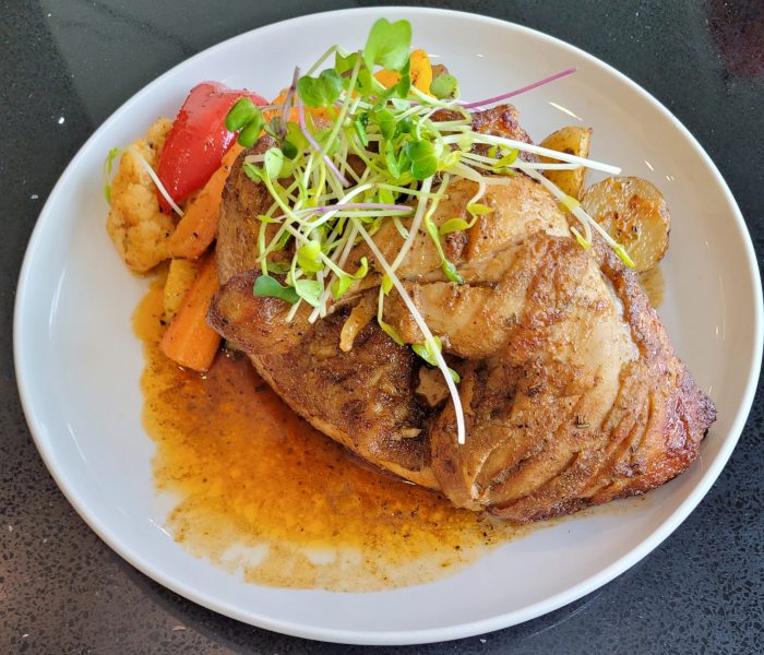 Amazing chicken dish with roasted vegetables and fresh sprouts on top as a garnish at 'Executive Residency by Best Western' hotel restaurant; Calgary, AB (Canada)