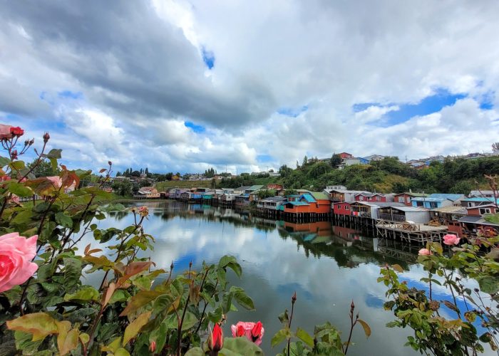 Colourful display of Palafitos de Pedro Montt at high tide; Castro, Chiloé Island (Chile)